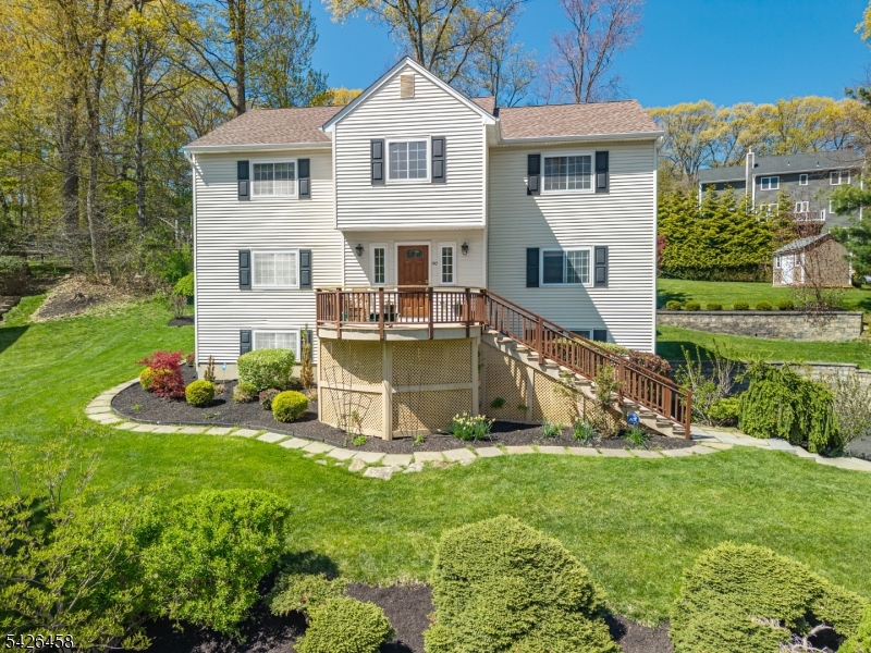 Beautifully maintained home in desirable Cobblestone Crossing on Randolph's east side with city water and sewer. Set on a private, landscaped lot with mature trees, stone walls, patio with lighting and maintenance-free deck in addition to front sun porch with views.  This house enjoys abundant natural sunlight with its southern exposure. Spacious family room opens to a renovated kitchen featuring granite countertops, Medallion maple cabinets with under-cabinet lighting, center island with wine storage, GE stainless steel appliances which includes three ovens and built-in ceiling speakers. First floor complete with newly updated powder room.  Upstairs offers an oversized primary suite with two walk-in closets and a large bath as well as three additional bedrooms all complete with hard wood flooring. Additional second floor beautifully updated custom bathroom.  Finished basement, complete with heat provides additional space for playroom, office or exercise room as well as additional storage. Additional home features include: 3 zone underground sprinkler system, frost-free hose bibs, outdoor gas line for grill, ADT security system and 12' x 8' storage shed. Major updates include: furnace 2023, A/C 2024, attic fan 2026 and Timberline High Definition Shingle roof. This pristine home is conveniently located near downtown Morristown with direct NYC train service.  This must see property provides access to top rated parks, recreation and sought after Randolph schools.