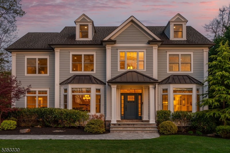 This stunning luxury residence boasts many features designed for both comfort and elegance. Beautifully landscaped with mature plantings on a generous .46-acre level lot on a cul de sac, this property ensures your serene privacy while still being close to all amenities. As you enter through the grand two-story foyer, you're greeted by soaring 9 ft ceilings and exquisite custom millwork that sets the tone for the entire home. The coffered ceilings in the living areas add an extra touch of sophistication as well as built in speakers for sound interior and exterior, floor to ceiling custom transom windows, remote custom window treatments, premium oak flooring throughout and spacious open floor plan. The chef's kitchen is outfitted with a Wolf 8 burner range, Wolf 3rd wall oven, pot filler, a Subzero refrigerator, and a large center island and stunning quartz countertops and backsplash elevate the space.The family room is centered around the gas fireplace, overlooking the expansive paver patio, perfect for outdoor gatherings and yard with room for a pool. With 5 bedrooms ensuite, everyone will enjoy their own personal retreat. The Primary suite is a true sanctuary, featuring elegant tray ceilings, a luxurious marble bathroom with a soaking tub, marble stall shower, private water closet, and a spacious walk-in closet. The finished basement has high ceilings, a full bath, an additional bedroom, and a designated room ready for a wine cellar. 3 car garage.Generator for peace of mind.