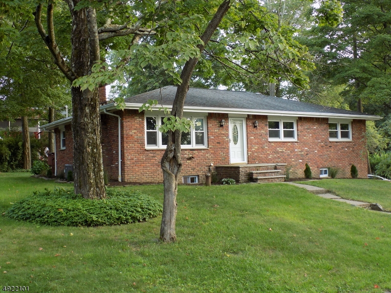 LIVE THE LIFESTYLE IN THIS DESIRABLE NEIGHBORHOOD.  WALK TO PARK & LAKE.  NEWLY RENOVATED WITH NEW SEPTIC, CENTRAL AIR, CUSTOM KITCHEN W/ISLAND, MASTER BD SUITE W/GORGEOUS BATH & WALK IN CLOSET, HARDWOOD FLOORS THROUGHOUT 1ST FLOOR. OPEN CONCEPT LR/DR W/STONE FIREPLACE.   RELAX IN THE SPACIOUS FAMILY ROOM IN THE WALK OUT LOWER LEVEL WHERE YOU'LL ALSO FIND YOUR  LAUNDRY ROOM & UTILITY ROOM.  EXCEPTIONALLY LARGE GARAGE FOR CARS OR  WORKSHOP.  EXTERIOR OFFERS DECK OFF KITCHEN AND ADDITIONAL PARKING AREA ON SIDE.  THIS HOME WILL NOT DISAPPOINT YOU!