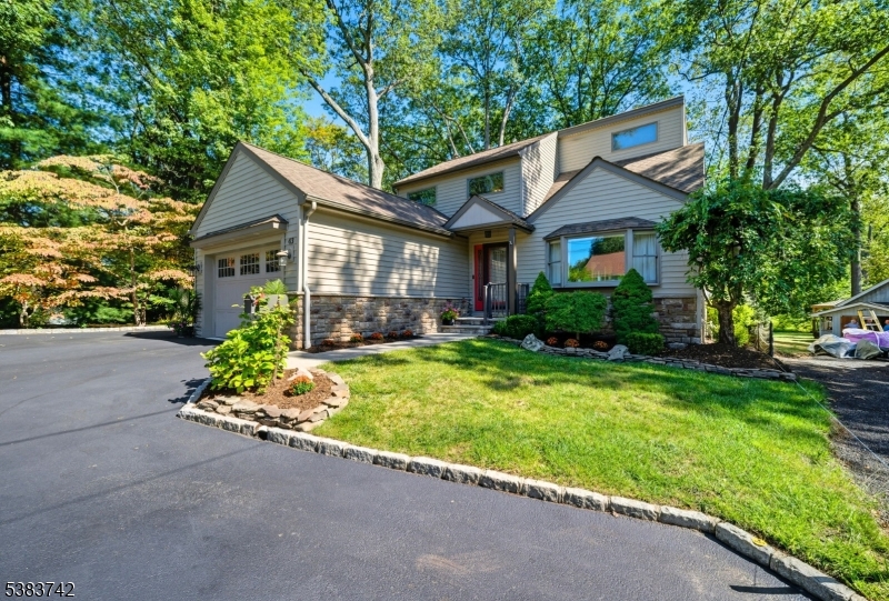 Exceptional Waterfront on Indian Spring (Pond). All of the charm you'd expect from a lake house lifestyle. METICULOUSLY MAINTAINED. Well-Designed 4 bd/3bath home that allows for a variety of floorplan options including 1st floor bedroom, office, exercise, playroom etc. The first floor currently set up with living room, boast cozy wood fireplace (or gas insert) & large back slider/window overlooking a private oasis. Kitchen equipped w/SS appliances, spacious workspace, light cabinetry, conveniently located laundry & pretty views of backyard. Bright dining area w/custom tile flooring & room to entertain many. Family room or 1st floor bedroom & office + heated/AC garage complete the 1st floor. Staircase to expansive 2nd floor w/3 generous sized bdrms, high ceilings, HW flooring & plenty of closet space. Fabulous primary suite soaring cathedral ceilings include bath w/jetted tub, double vanity, shower, walk-in closet & pretty seasonal views. 2nd & 3rd Bdrm offer tons of natural light & shared bathroom. Time for relaxation in a serene, scenic setting. Heated, salt water, above ground pool off of back deck. Grilling Area w/gas hook-up. Firepit. Paver Patio by Pond. Outdoor Shower. Sprinkler System. Shed. New blacktop driveway, paver walkway. Short walk to one of Indian Lake's 3 beaches & clubhouse for activities. Swimming, Fishing, Boating, Ice-Skating. Minutes from downtown Denville for shopping, restaurants & so much more. Excellent school system. Easy commute into NYC.