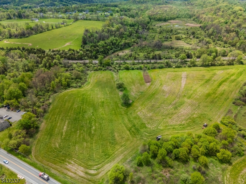 Rare opportunity to own approximately 17 acres of farm-assessed land in desirable Hardyston Township. Currently utilized by a local farmer, the property benefits from exceptionally low taxes through farm assessment while offering significant long-term upside for investors, developers, or end users. Positioned within a growing commercial corridor with excellent frontage and high visibility, the property offers easy access to major routes including Route 23, shopping, golf courses, resorts, and commuter access. The site previously received mixed-use approvals (buyer to perform all due diligence), presenting exciting future redevelopment potential including possible subdivision and mixed-use commercial/residential development, subject to township approvals. The land features beautiful mountain views, a peaceful stream running through the property, & a ton of open usable acreage. Whether held as an investment, continued for agricultural use, or explored for future development, this property offers a rare blend of natural beauty, accessibility, and future opportunity in one of Sussex County's increasingly sought-after locations.