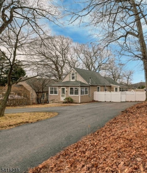 Charming redone home with primary suite conveniently located on the first floor.This entire home has been renovated including a newer kitchen with ss appliances, updated baths,  redone flooring, custom molding and recessed lighting. Abrand new privacy fences was installed to create your own secluded outdoor environment. From the warm pellet stove to the inviting sunroom this house is ready for you to call it HOME!