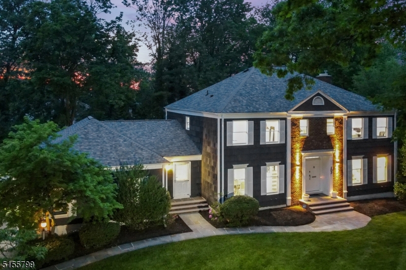 Impeccably Updated and Renovated from top to bottom by the current owners! This Stunning, Sun Drenched; 5 Bedroom 4.5 Bath Center Hall Colonial is unparalleled in its harmonious flow of open floor plans, oversized bedrooms, tastefully renovated bathrooms & powder room, Gourmet Chef's Kitchen, expansive finished basement, 3 Car garages, & Private fully fenced Enormous backyard. A beautiful blue-stone walkway leads to a gorgeous patio adorned with stately Double entry doors which open in a grand entry foyer flanked by impressive living and dining rooms. Illuminated by LED light fixtures, & beautifully finished hardwood floors, make your way into the Family Room overlooking a captivating backyard with gorgeous views of sun-set, flowing seamlessly in a cutting-edge eat-in kitchen with sliders leading to the beautifully curated blue stone patio.1st floor also encompasses a bedroom and a large laundry area that can be easily converted into a 5th Full bath. 2nd  floor is resplendent with 4 oversized bedrooms, 3 exquisite baths, and walk-in closets. Fully finished basement with plenty of room for recreation, home office, play area, a full bath, and an extra room; make this home exceptionally welcoming and spacious. The home has been painted inside and out in gorgeous neutral colors. Located in the prestigious Hartshorn Section of Short Hills, steps from Gero Park, offering Millburn Rec Playing Fields, Play-Ground, Millburn Exclusive Swimming Pool, Tennis Courts, and Golf Course.