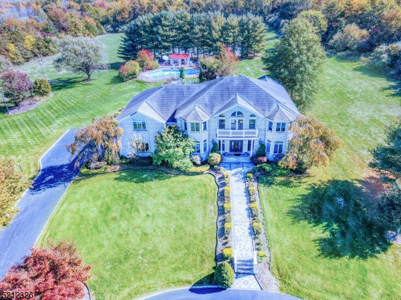 Magnificent Custom built home, 7406 Sq Ft on a spectacular 6.37 ac grounds. Very desirable area, from the moment you enter the gates you will be taken by its beauty. Large entry Foyer with dual staircases, polished marble floors, Detailed moldings throughout the Home. Offers first floor bedroom and full bath. Living room that leads to Office/Library. Oversized Dinning room, Two story Family Room with Fireplace, off the Fam Rm is Sunroom perfect for working out. Brand new Kitchen Porcelain floors and Quartz Counters, New stainless appliances, Sub Zero Frig. Master suite with separate sitting room being used as office. Second floor offers a second fam rm with vaulted ceilings. Full basement Finished with new carpet, 3 bedrooms have new carpet, Wood floors just refinished, Downstair foyer, hallway, Kitchen, second floor hallway, 3 bedroom, and all doors just painted. Beautiful patios, Inground pool and Pool House, Very large Koi Pond with close to 200 Koi. Full size Tennis Court, Tons of outside lighting, New garage doors, 3 zone heat and AC 2 are 2 years old, Generac Generator new battery and plugs. This house has it all showings start 4/8
