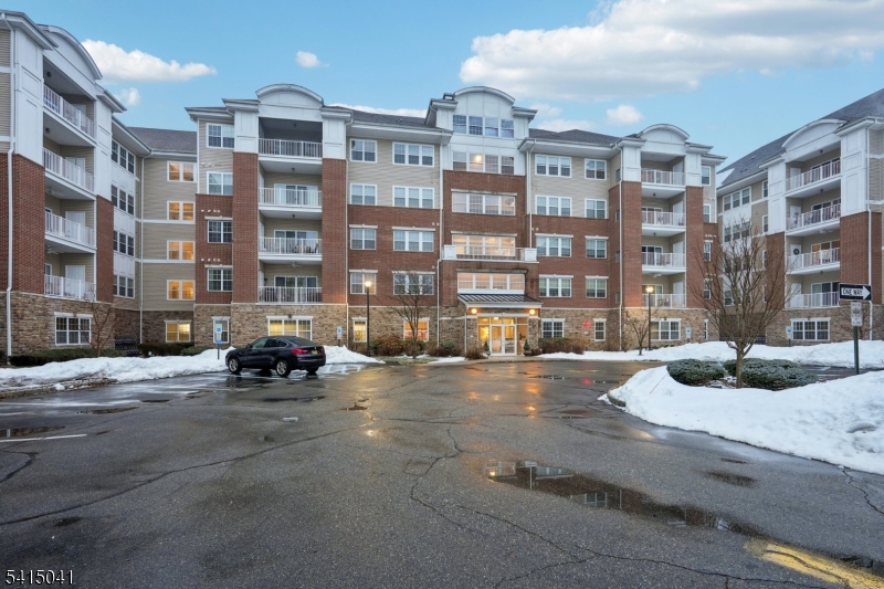 Welcome home to this beautifully maintained 2-bedroom, 2-bath Colfax unit Townhome located in the premier 55+ gated community of Wanaque Reserve, offering 24-hour security and an exceptional resort-style lifestyle.Step inside the welcoming entry foyer that opens to a spacious living room with soaring ceilings, crown molding, and an inviting atmosphere ideal for everyday living or entertaining. Sliding glass doors fill the space with natural light and lead to the balcony perfect for enjoying morning coffee.  A cased opening leads to the formal dining room featuring custom molding, creating a warm setting for intimate dinners or hosting guests. The eat-in kitchen offers granite countertops, custom cabinetry, stainless steel appliances, and separate dining area. French doors open to a versatile den that works as a home office, hobby room, or cozy sitting area. The primary suite features a tray ceiling, two closets including a walk-in closet, and a private full bath. A second bedroom, full bathroom, and conveniently located laundry complete the home. Recent updates include a new hot water heater and air handler. Residents enjoy a vibrant, pet-friendly community with outstanding amenities including a clubhouse with cafe, fitness center, theater, sauna, ballroom, and indoor and outdoor pools. With over 45 clubs and activities from travel and tennis to pickleball, golf, cards, and social events this community offers an active, engaging lifestyle in a beautiful setting.