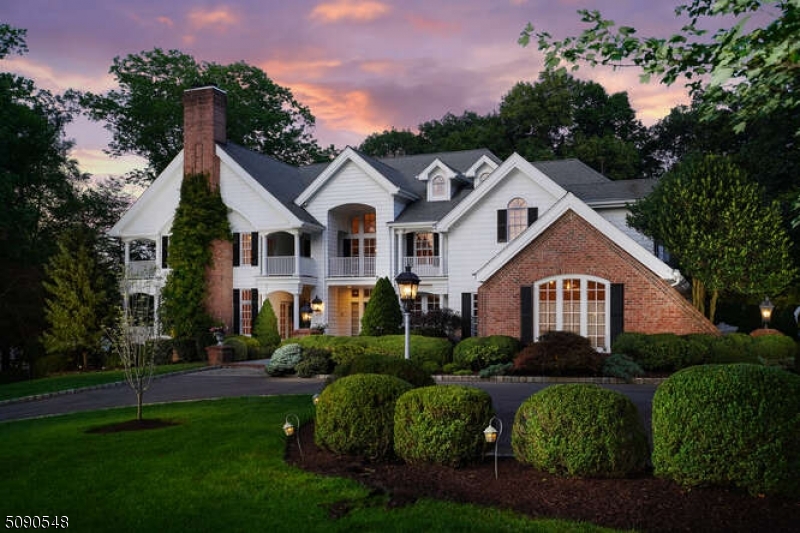 Pristine one of a kind property w/ timeless architecture & design, nestled on a quiet tree lined cul-de-sac.  Breathtaking 2-story entryway leads to a distinctive bar room ready for entertaining or relaxing by the fireplace. The chef grade kitchen features a colossal island & breakfast nook w/ fireplace; awaits your culinary indulgences.  Enjoy the outdoors all year round in the unique screened-in porch area & spacious blue stone patio.  Expansive picturesque views from the panoramic terraces of the extraordinary MBR suite which boasts a fireplace, 3 WICs, separate vanity area w/ sink, & dual stand up shower.  Limitless options for recreation in the vast lower level which is highlighted by a temp controlled walk-in wine cellar, full bath, gym, golf simulator & walk out to garage.  Whole house generator.
