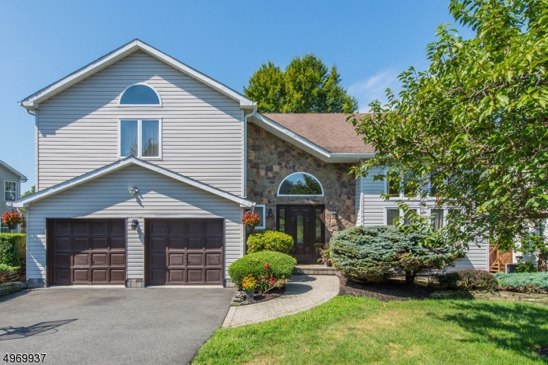 Come see this well-kept center hall colonial in The Summit's picturesque neighborhood. A sunny 2-story foyer leads to open floor concept living w/great options for entertaining. Beautiful wood floors! Upstairs are the spacious owner suite and 3 bedrooms; both full baths were updated Jan 2020. Eat in kitchen has newer stainless-steel appliances and granite countertops. Cozy up by the family room's wood-burning fireplace in winter or relax outdoors in summer on the deck/patio off the kitchen in your private backyard oasis. A full finished basement renovated in 2019 has an office, rec room, laundry and plenty of room for storage. Access to major highways, NYC Direct transit, schools, and recreation. Newer hot water heater, deck, and AC unit make for care free maintenance.