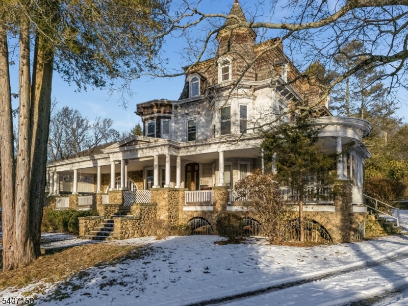 Unique Property. Victorian Mansion. 35.09 acres of improved land with an extensive array of existing structures and amenities. Due to Highlands regulations, further subdivision or redevelopment is restricted, making this ideal for a buyer seeking to rehabilitate, restore, or continue use of the existing improvements. At the heart of the property is a Victorian era residence showcasing historic craftsmanship. Home features fireplaces, hardwood flooring, stonework, current permit for 10 furnished rooms in main house. An efficiency apartment in main residence The expansive grounds include several multifamily residential buildings with rental potential, approx 24 one room cabins, and rec hall. The property features sheds, workshops & utility buildings, Additional amenities include designated trailer and RV sites with existing infrastructure, 6 established campsite pads with fire pits. Electric service throughout the grounds supporting a variety of recreational and operational uses including an inground pool with picnic area, hot tub, sun deck, volleyball & shuffleboard courts. The expansive layout and existing features provide flexibility for a variety of permitted uses, The property does require rehabilitation and is best suited for a buyer with vision who understands the value of improving and maintaining existing structures within the Highlands framework. A rare opportunity to acquire a large, improved tract with historic character.