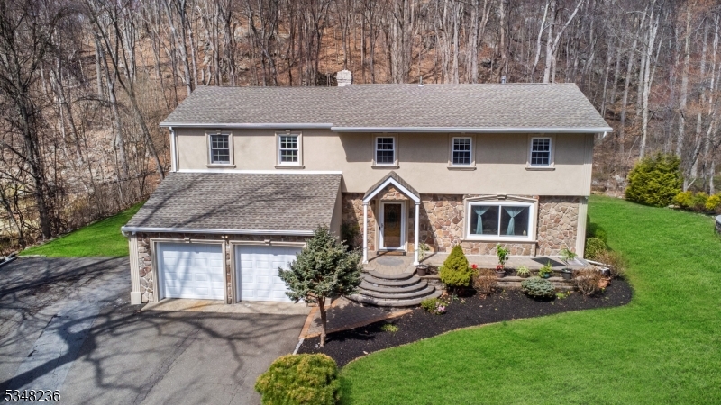 Located in the heart of Kinnelon, offering 4 spacious Bedrooms, a BONUS OFFICE space, and 2.5 bathrooms, it features a variety of living areas, including a bright living room, elegant formal dining room, and a family room, all adorned with gleaming hardwood floors. Modern finishes and amenities throughout make this home both stylish and functional. Oversized deck and enjoy a vast, beautifully landscaped yard ideal for outdoor entertaining or simply relaxing.This home has been meticulously maintained with updates that include newer windows, a 5-year-old roof, upgraded furnace, 2 newer AC/Heat units, and a 12 zone sprinkler system. Located within walking distance to Kinnelon High School, Kiel Elementary School, and the Kinnelon Public Library this home offers unbeatable convenience. Plus, you're just a short distance from a private lake, Silas Condict County Park, shopping centers, and more. Don't miss the chance to make this beautiful property yours! Schedule your showing today and experience the charm of Kinnelon living.