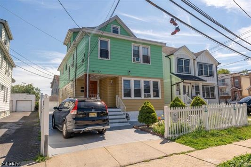 Well-maintained 2-family home in the heart of Elizabeth, offering a great opportunity for both investors and owner-occupants. The first-floor unit features a living room, kitchen, 3 bedrooms, and 1 full bath. The second-floor unit offers a similar layout with a living room, kitchen, 3 bedrooms, and 1 full bath. The home also includes a full finished basement, providing additional recreational space or office, plus an attic that can be used as an office, recreation area, or for extra storage. Outside, you'll find a detached garage, parking for 3+ vehicles, and a nice backyard. Conveniently located near shopping, dining, schools, public transportation, and major highways. A solid multi-family property with plenty of potential. Schedule your showing today!