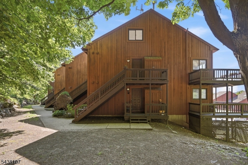 Enjoy breathtaking views from this 2 bedroom, 1 bath end unit condo in the highly desirable Great Gorge Village. Bathed in natural light, this bright and inviting home features an open concept layout with a spacious living and dining area, perfect for everyday living. Step outside to the wrap around deck and take in the stunning scenery while enjoying your morning coffee or unwinding after a day on the slopes. Updates include refinished hardwood flooring, freshly painted and new carpeting on the second floor, creating a move in ready opportunity. Also offers ample closet space and a functional floor plan designed for comfort and convenience. Ideally located just moments from Mountain Creek, enjoy year round recreation including skiing, mountain biking, hiking, golf, water park attractions and local dining. Whether you're looking for a full time residence, weekend retreat, or income producing investment property, this exceptional home offers the perfect combination of lifestyle, location, and spectacular views.