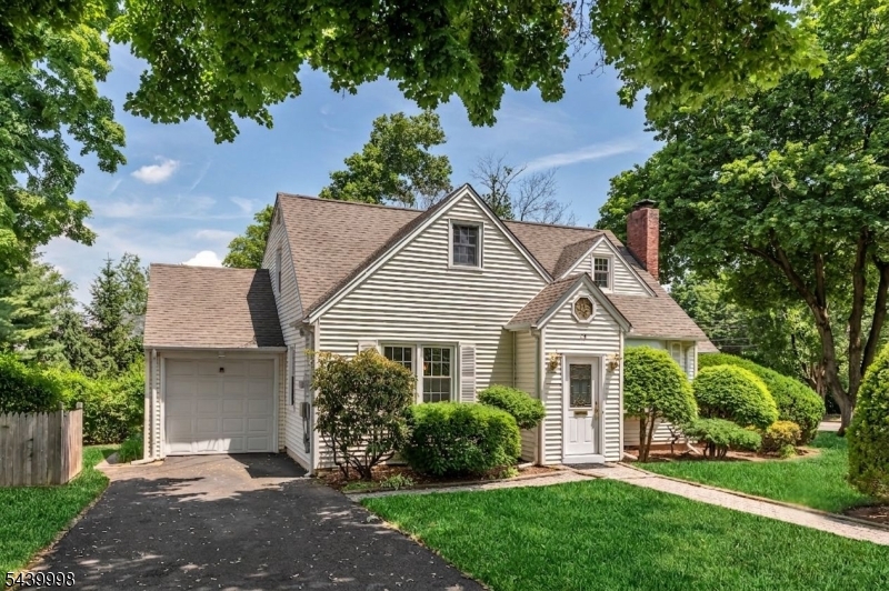 Move right into this adorable cape cod in a prime location! A welcoming entry foyer opens to a sunny living room with a fireplace, creating a warm and inviting first impression. The renovated kitchen with a breakfast bar overlooks the dining room, offering an easy flow for everyday living and entertaining, while a nearby light-filled sunroom provides the perfect spot to relax. Two first-floor bedrooms and a hall bath offer convenience and flexibility. Upstairs, you'll find two additional spacious bedrooms, including one with a bonus room ideal for a home office or future walk-in closet. The finished lower level adds even more living space with a rec room, laundry and surplus of storage. Freshly painted and many recent updates, this move-in ready home sits on a nearly quarter-acre property just minutes from schools, parks, NYC transportation, dining and more!