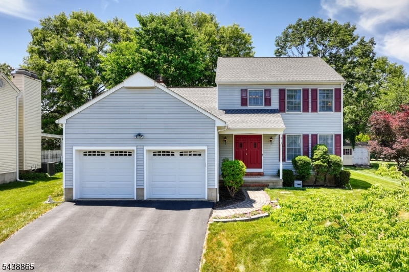 Classic Colonial tucked in a lovely, quiet cul-de-sac neighborhood offers a new roof (approx 5 yrs old), new A/C (1 year old) & wood flooring throughout. Combining classic style with modern conveniences, the main level features a warm and inviting layout, perfect for both everyday living and entertaining. A welcoming home starts with a double front door and spacious Foyer upon arrival. Adjacent to the Foyer is a Living Room/ Home Office with french doors- ideal for working from home. This Home Office/ Living Room shares a common wall w/ the Dining Room on the other side & was converted by current owner from an Open Living Rm/Dining Rm combination into 2 functional & private rooms. The Kitchen is conveniently situated between an ample Dining Rm & spacious Family Rm. The sunny Family room features space for all, high ceiling w/stylish wood beam, skylights, Fireplace and sliders to the deck & yard. Upstairs, you'll find a generously sized Primary Bedroom Suite w/2 closets & a renovated Bathroom. 2 additional Bedrooms w/ wood floors complete the upstairs. The unfinished Basement offers endless possibilities to make the space your own- music/media room, playroom, home gym, office, or storage. Outside you'll find a lovely & flat backyard w/ mature trees for shade a deck- the perfect spot for your morning coffee or unwinding at sunset. This charming home is tucked into a quiet neighborhood, yet conveniently close to schools (award-wining BRHS), shopping, parks, major highways.