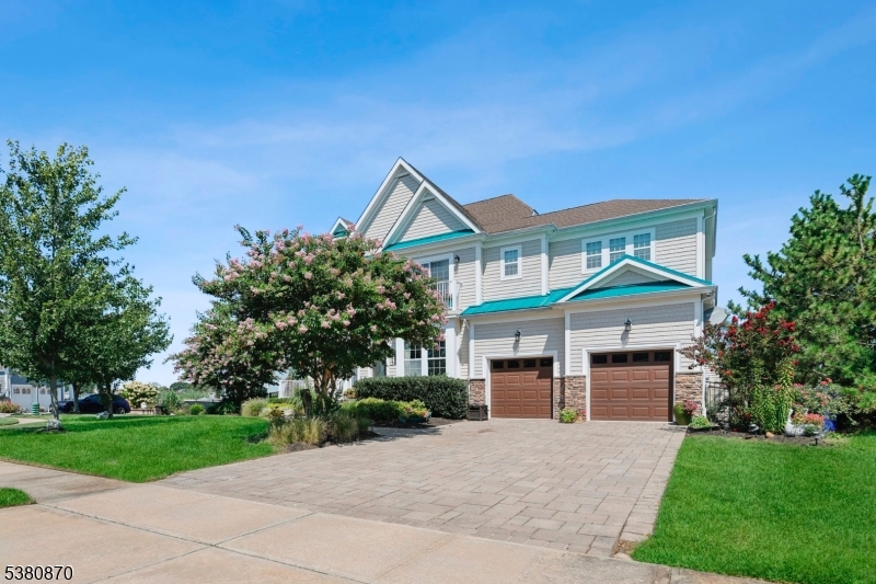 Stunning waterfront Colonial in The Sanctuary on Beaver Dam Creek. This 3,600+ sq ft home offers 4 bedrooms, 4 full baths, and a versatile third-floor bonus room with water views. Interior features include hardwood flooring throughout, vaulted ceilings, gas fireplace, custom moldings, and a well-kept gourmet kitchen with granite counters and stainless steel appliances. Spacious ensuite bedrooms and spa-like baths add to the appeal. Outdoors, enjoy a paver patio with firepit, a private 35'x17' boat slip, and added privacy with open association land next door. Complete with a 2-car garage and easy access to schools, shopping, and the Jersey Shore lifestyle.