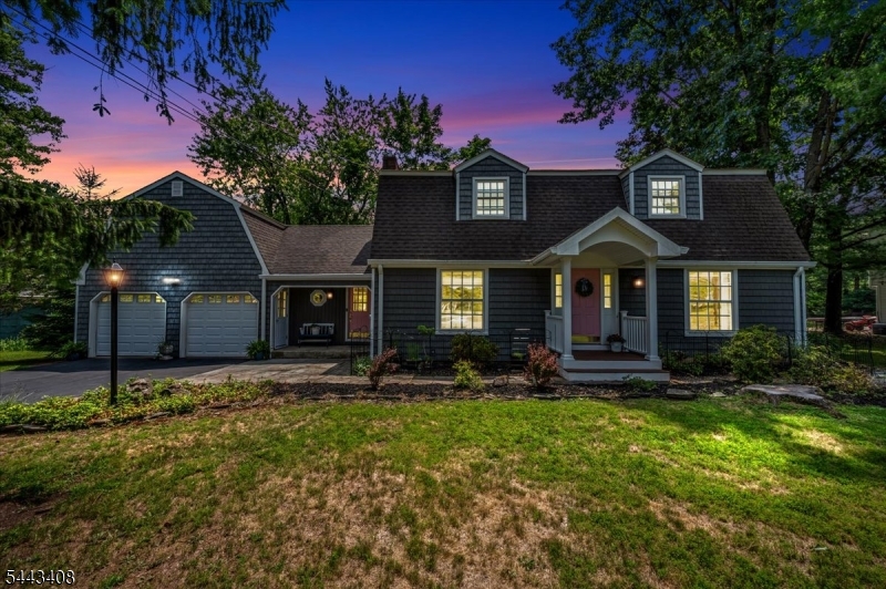 Welcome to this beautifully maintained 4-bedroom, 3.1-bath Colonial set on a sprawling, level lot surrounded by mature trees, offering exceptional outdoor space and timeless curb appeal. A welcoming foyer opens to the spacious formal living and dining rooms, creating the perfect setting for entertaining and holiday gatherings. The heart of the home is the updated kitchen featuring stainless steel appliances, abundant cabinetry, and a breakfast bar overlooking the inviting family room with a stunning brick fireplace. Sliding doors lead to a spacious deck and expansive backyard, offering endless opportunities for outdoor entertaining, play, or simply relaxing in the peaceful surroundings. A rare highlight of this home is the private en-suite, complete with its own beautifully updated full bath, making it ideal for guests. An updated powder room adds convenience to the main level, while the second floor offers generously sized bedrooms, including a spacious primary suite and an additional full bath. Combining classic charm, thoughtful updates, and a versatile floor plan, this home is ideally located near parks, shopping, dining, and major commuting routes. With its impressive flat lot, flexible living spaces, and warm, welcoming feel, this is a home you'll be proud to call your own.