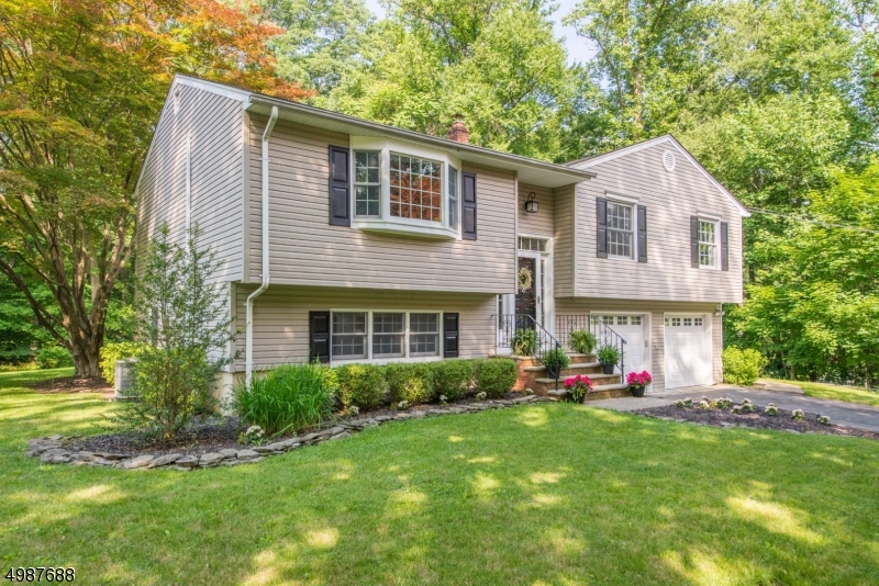 Not a thing to do but unpack!  Beautifully updated and maintained home in convenient Valley location Capital Estates!  Kitchen with cathedral ceiling, sliders to entertainment size deck overlooking private, level yard.  Tremendous curb appeal with low maintenance vinyl siding, professional landscaping and new front and garage doors. Hardwood floors throughout main living level, freshly renovated lower level with updated bathroom, new flooring and recessed lighting.  Interior freshly painted, newer windows, blinds, central air in 2019.  Old Farmers Road  and West Morris Central HS district, close to Restaurant Village, 5 minutes to Chester, public water, sewer and natural gas.  This home has it ALL!