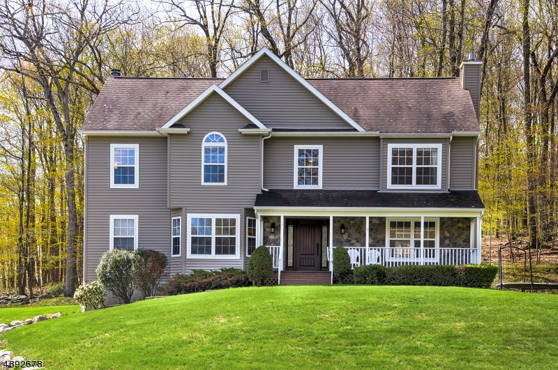 BEAUTIFUL SPACIOUS COLONIAL ON 1.15 ACRES IN DESIRABLE AUTUMN HILL!! First time offered, this meticulous home has a welcoming, bright, wonderful flow. Sit in your 2 story living room by the wood burning fireplace, while looking at the beautiful tree lined backyard through the sliding glass doors. The large eat-in kitchen offers plenty of cabinetry, along with a center island and double wall oven, great features when entertaining! Roomy bedrooms with fabulous natural light. Great location for commuters and close to Sparta Center as well. Nothing to do but move right in, sit on your front porch and enjoy the view!