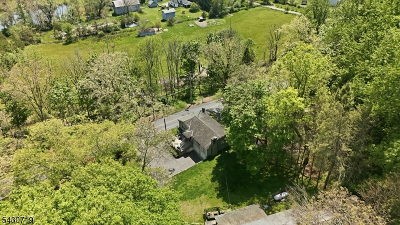 Welcome to this spacious 3-bedroom, 2-bath raised ranch set on a beautiful 1-acre property in a convenient Blairstown location. Featuring eat in kitchen, spacious living room with fireplace, and pella windows, this home offers endless potential for buyers ready to add their personal touch and make it truly their own. A standout feature is the detached workshop complete with three-phase electric, a half bath, and abundant storage space   ideal for contractors, car enthusiasts, small business owners, or hobbyists needing room to work and create. Enjoy the perfect balance of privacy and convenience, just minutes from downtown Blairstown, everyday shopping, Route 94, and easy access to Route 80 for commuting. With generous indoor and outdoor space plus incredible functionality, this property is packed with opportunity and imagination-ready potential. Home conveyed as is.