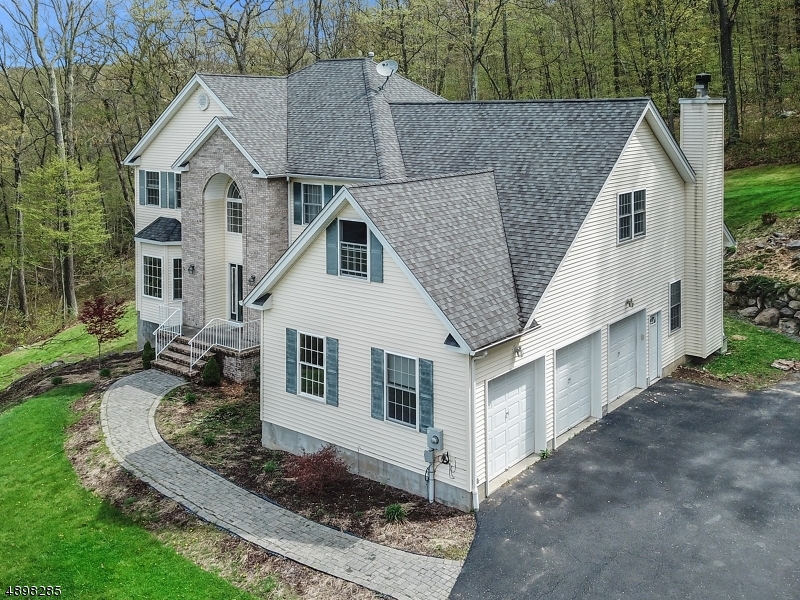 GREAT VALUE- 150k UNDER ASSESSMENT.  CUSTOM HOME OFFERS SPECTACULAR MOUNTAINTOP VIEWS & PLENTY OF PRIVACY YET SET IN NEIGHBORHOOD ON CUL-DE-SAC.  GOURMET KITCHEN, GREAT ROOM W/FPLC, SPACIOUS BEDROOMS, 1ST FLOOR OFFICE & INCREDIBLE MASTER BEDROOM SUITE.  ENORMOUS UNFINISHED WALK-OUT BASEMENT HAS SLIDERS TO YARD & ADDED BLOCK TO BASEMENT HEIGHT.  PUBLIC WATER AND NATURAL GAS HEAT ARE ADDED BONUS.