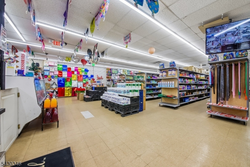 Prime retail opportunity on one of Rahway's busiest corridors. This versatile commercial space can be configured up to 4,000 square feet, making it a strong fit for a wide range of retail or service-based businesses. High ceilings give the space an open, flexible feel, and rear access with a loading area makes operations easy. Private on-site parking is a major plus in this location.Previously operating as a Dollar Store, the space is move-in ready with solid infrastructure already in place. Situated on W Grand Ave with high daily traffic counts, your business gets immediate visibility from day one.