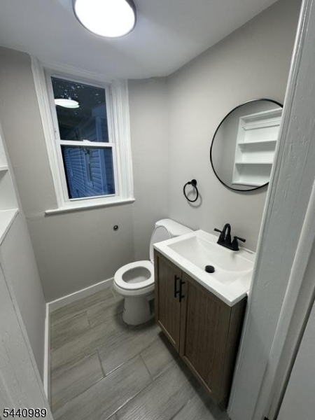 Freshly renovated 3-family investment property featuring extensive upgrades throughout. Each unit offers updated kitchens, renovated bathrooms, brand-new luxury vinyl plank flooring, and new carpeting. The exterior boasts brand-new vinyl siding, while most windows have been replaced with energy-efficient vinyl windows. Major mechanical improvements include new HVAC systems with forced hot air and central air conditioning. Units A and B feature large-capacity systems with dual-zone heating and cooling for added comfort and efficiency. All three units have separate gas and electric utilities, separate entrances, and individual laundry hookups. The property also offers two separate driveways with parking for 6+ vehicles, making it ideal for tenants and owner-occupants alike. A turnkey opportunity with modern updates, low-maintenance features, and strong income potential. Only a short walk from the train station.