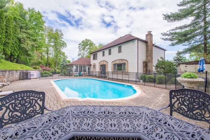Warm, Welcoming Stately Colonial! Private property nestled within a lovely neighborhood on quiet Cul-De-Sac. 30" front patio w/firepit offers magnificent views. Numerous updates throughout the home. Radiant FR w/gas fireplace. EiK boasts a breakfast bar, granite counters & slider to stunning backyard.  Magnificent 1st floor layout includes Formal Living & Dining, Office (5th Bdrm), Laundry, Full Bath & Posh Foyer. 3 Season Room offers wet bar & gateway to 20/40 inground pool & 2000 sqft paver patio. Truly an outdoor sanctuary & great place to entertain. Solid wood & glass front door & HW flooring are just a few features that make this a standout home. Mstr Suite offers additional closet space & newer bath. 3 more spacious bdrms, sitting area & attic. Tons of poss in full, unfinished bsmt. 2 Car Garage.