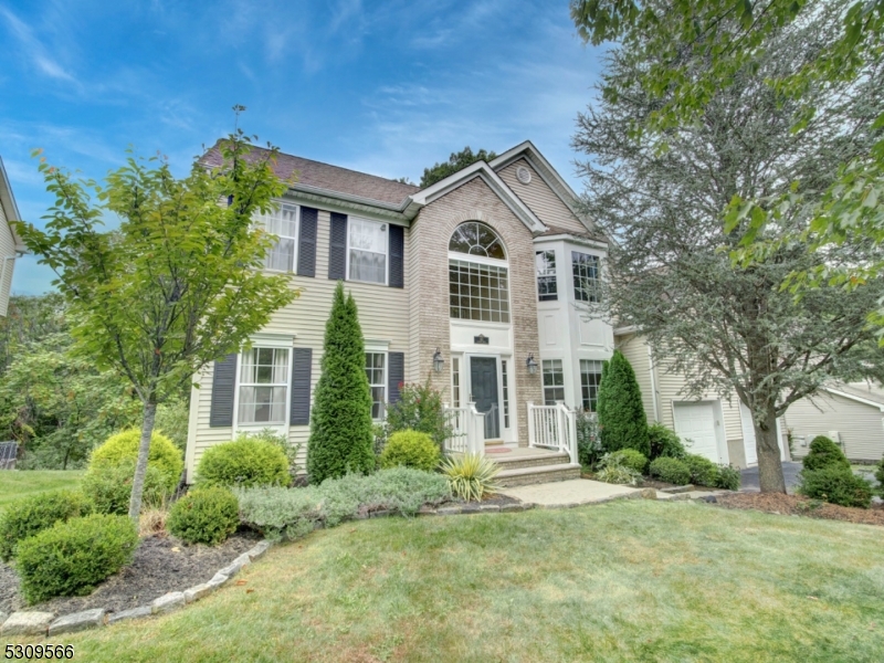Beautiful Colonial featuring two story foyer, first floor office that can also be used as 5th bedroom, formal living room & dining room, large kitchen with center island, granite countertops, pantry, separate dining area & French door leading to private, entertaining sized deck overlooking tree lined, wooded yard. The family room is adjacent to kitchen and boasts vaulted ceilings & stone gas fireplace. Kitchen & family room have just been painted with trendy color, Sherwin Williams Alabaster. Powder room & laundry room that leads to two car garage complete the first level. Ascend to the second floor to a dreamy primary suite complete w dressing room, huge walk in closet, separate room that is very versatile and can be used as office, nursery, exercise room, etc plus large ensuite with vaulted ceiling, dual vanity, soaking tub & shower. Three other bedrooms and main bath complete the second floor. Big bonus here is the full, walkout finished basement. Large windows and slider doors make you feel like you are not in a basement. It includes an open recreation area, bar, and separate room that can be used for whatever your heart desires. Plenty of storage here, too. Other features include wood floors on first and second floors, public utilities and ONE YEAR HOME WARRANTY.