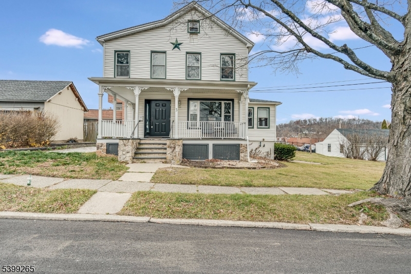 Charming Victorian-style Colonial w wrap around porch in the heart of Downtown Newton! Walkable convenience, flexible living space, and a rare 3-car garage with a full loft. A new front door leads you inside to the foyer and updated staircase. Down the front hall is the refreshed kitchen that offers ample cabinetry, a center island, tiled backsplash, and direct access to the side porch and paver patio for grilling and outdoor dining. A spacious living/dining room off kitchen features a picture window & updated fixtures. Just off the living room is a sun-filled den with a built-in desk perfect for a home office, playroom, or reading nook. Upstairs are three bedrooms with updated flooring, a full bath, and a spacious laundry room w W/D included. Walk up attic for storage or space for future primary suite. Finished walkout basement adds flexibility w full bath and 4th bedroom/office ideal for a guest suite, live-in setup, or potential conversion to a 1-bedroom apartment. Flat side yard for additional outdoor space. Oversized 3 car garage w second-floor loft is a standout feature great for storage, home business, workshop, studio, hobby space, or future expansion. Driveway provides ample parking, and the garage has a newer roof. Public water, public sewer, and steps from shops, dining, parks, and all Downtown Newton offers - plus just minutes to big box stores, fast casual restaurants and grocery. FREE full day preschool and FREE membership to the Newton Pool for residents.