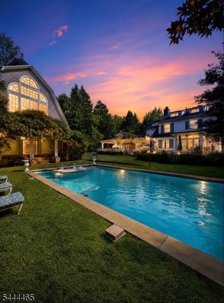 This is a rare luxury estate offering the ultimate in privacy, recreation, and flexibility. The impressive main residence features spacious living and entertaining areas, generously sized bedrooms, and thoughtfully designed interiors that blend comfort with elegance. This exceptional property features a resort-style backyard complete with an in-ground pool, two hot tubs, sauna, steam room, basketball court, greenhouse, pergola, and beautifully landscaped grounds designed for year-round enjoyment.A standout feature is the fully detached carriage house with its own kitchen, living room, bedrooms, and bathrooms?ideal for guests, a private office, or rental opportunities.Perfectly situated just minutes from downtown Englewood, shopping, dining, and easy access to New York City, this one-of-a-kind property offers an unparalleled lifestyle with endless possibilities.