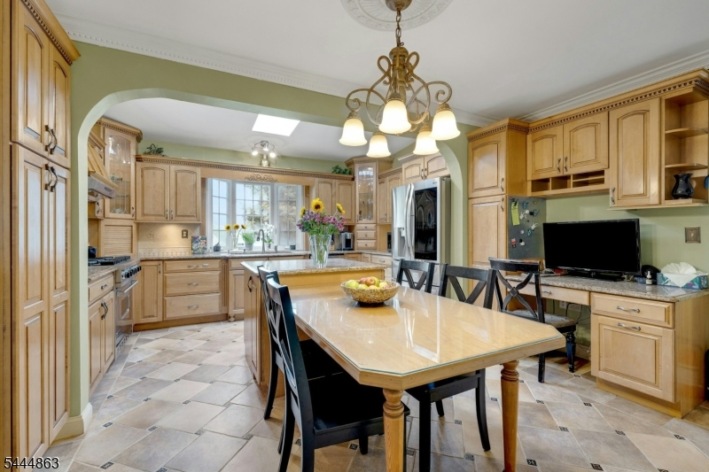 EXPERIENCE a year-round LAKE LIFESTYLE with a PRIVATE DOCK ON GREENWOOD LAKE's east shore while living in this BEAUTIFUL 5 BR/4.5 BA ESTATE-LIKE HOME. Nestled in the private AWOSTING LAKE COMMUNITY, and just 15 MI TO BERGEN CTY, this has it all!  You have to love the original 1920s stone fireplace in the large living room with bay window that captures BREATHTAKING SUNSET VIEWS. Enjoy this view from many other rooms. Designed for those who love to entertain, the home features a CHEF-GRADE GOURMET KITCHEN with expansive island & a BANQUET DINING ROOM for holiday gatherings. The GRAND GATHERING ROOM offers ample space to gather, and the home's true secret lies in its PRIVATE REAR LIVING space. This versatile wing includes a dedicated den/game room and a SECLUDED 2ND FLOOR BR/STUDIO complete with its own full bath and laundry the perfect setup for an in-law suite, home office, music/art studio, or guest retreat. The main house's second floor hosts a LUXURIOUS PRIMARY SUITE with an ensuite bath and laundry, alongside three additional bedrooms, a hall bath, and a WALK-UP ATTIC. Perhaps the most coveted feature of all: this property conveys its own PERSONAL LAKEFRONT DOCK, your private gateway to the waters of Greenwood Lake.  The rear yard is fully fenced & lawn is expansive leading to an ideal 2-car garage with 2nd floor room. This is a SMART-GREEN HOME,  both Tech-Enabled & Solar-Powered!  Why wait for the weekend?  MAKE EVERY DAY AN ESCAPE.