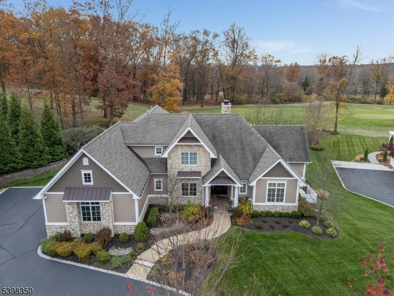Absolutely stunning home located within The Cottages at Hamilton Farm, a gated enclave of unique luxury residences.  Impressive stone entry leads to an open floorplan, smoothly flowing into the two-story great room with soaring windows and a gas fireplace. French doors open to a spectacular outdoor pavilion overlooking the Hickory Golf Course. Designed for gracious entertaining, the expansive patio features a covered dining terrace, with steps down to a cozy seating area, stone fireplace, and a fully-equipped weatherproof teak outdoor kitchen. Inside, the brilliant kitchen offers island bar seating, fine finishes, and designer SS appliances, plus a separate dining area. A private home office is richly appointed with modern lighting, coffered ceiling and custom cabinetry. First-floor owners' suite provides a peaceful retreat, with its vaulted ceiling, ensuite bathroom, luxurious soaking tub, and huge professionally- outfitted walk-in closet. The lower level is an energetic social space: an illuminated quartz bar and climate-controlled wine room adjoin a large recreational area. Professional-quality home gym. Three-bay garage features a car lift and golf-cart space. Kohler whole-house generator and 12-zone sprinkler system. Enjoy the gorgeous views, lush landscape, and proximity to exclusive lifestyle amenities: two world-class golf courses and clubhouse, in an area known for prestigious equestrian activity.
