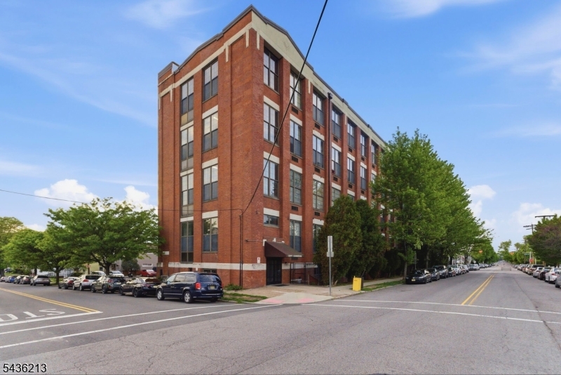 Welcome to The Loft Commons, 2F, one of the only true loft-style communities in South Paterson offering authentic city-style living outside NYC. This SOHO-style 1-bedroom loft features soaring 15-foot ceilings, oversized industrial windows, exposed brick, wood beams, and a open-concept layout filled with natural light and character throughout. Unit 2F offers a spacious living area, spiral staircase, loft-style bedroom space, and an updated kitchen overlooking the oversized windows and brick interior, creating the true warehouse-style aesthetic loft buyers are searching for. The building includes elevator access, assigned parking, and a recently updated lobby, all conveniently located near Route 80, Route 20, shopping, dining, and transportation. Less than 45 minutes to NYC. Enjoy being moments from some of the area's most popular restaurants, including Al-Basha Restaurant on Crooks Ave, recently recognized by USA Today as one of the best restaurants in the United States. A unique opportunity to own one of the most distinctive loft-style living spaces available in the area. HOA fee: $455.93/month. Assigned parking space available for $35/month. Condo ready to view - Seller occupied but super easy to show.