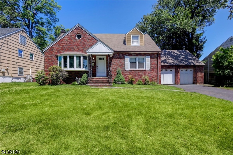 Multiple offers received. Best and final offers due by Wednesday 6/17 at 5pm. Heart of Unami Park! This spacious brick-front Cape Cod blends an incredible location and an abundance of functional space on an oversized lot, offering a value-packed opportunity to bring your personal touches and build instant equity. Natural light beautifully brightens the home, highlighting the wood floors throughout plus hardwood under the carpeted areas. The layout boasts large bedrooms with great storage space and a relaxing three-season room. A partially finished basement adds a ton of additional living space to the home, complete with a separate workshop room and the dedicated space to develop a true second kitchen, making it the perfect footprint for a private retreat or an in-law suite setup. The two-car garage features a massive loft above with a ton of extra storage. Enjoy being just minutes to the Garwood train station for easy NYC transit, while experiencing near-instant access to the vibrant downtown dining, shopping, and top-rated schools of neighboring Westfield, Cranford, and Clark.