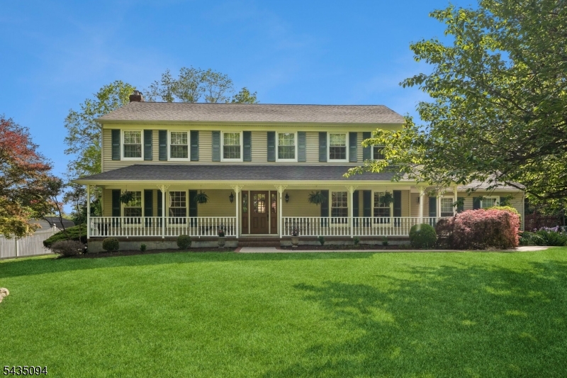 Welcome to this beautifully maintained Traditional Center Hall Colonial, ideally set on a picturesque tree-lined street on almost an acre of level property. Relax on the inviting rocking chair front porch while enjoying the perfect blend of charm & space. The first level features a Formal Living Room, Dining Room, & spacious Family Room with hardwood floors & crown molding throughout. The Family Room offers custom built-ins flanking a cozy gas fireplace, creating the perfect gathering space. The large Eat-In Kitchen is designed for both everyday living & entertaining, complete with granite countertops, stainless steel appliances, breakfast counter, vaulted ceiling, skylight, & bay window. Recent updates include a new range (2025) & dishwasher (2024). French doors lead to the bright & airy four-season Sunroom. Step outside to an expansive deck, unwind in the hot tub while overlooking the private fenced backyard with mature trees. Upstairs offers 4 generously sized bedrooms, including a primary suite with a great walk-in closet & remodeled bath (2019). The finished basement adds exceptional living space with a work-from-home office, entertaining area, workout room & separate storage/utility room. Additional highlights include storage shed, upgraded windows & doors, public sewer, water & natural gas. Enjoy a peaceful country feel while remaining conveniently close to shopping, restaurants, parks & major roadways. Located in an Excellent School System. THIS Home Truly Has It All!