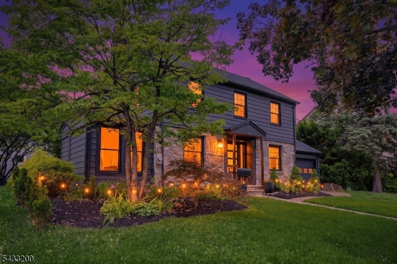 Perfectly positioned close to everything while privately tucked away from the bustle, this beautifully renovated Colonial blends timeless charm with modern convenience. Thoughtfully updated from top to bottom, this move-in ready home features a new roof, renovated kitchen and baths, updated systems, EV charger, electric blinds, and stylish finishes throughout.The welcoming first floor offers a spacious living room with wood-burning fireplace, formal dining room, sun-filled family room overlooking landscaped grounds, and a flexible den/home office with its own heating and cooling system. The updated kitchen is designed for everyday living and entertaining with quartz countertops, stainless steel appliances, center island with breakfast bar seating, abundant cabinetry, and separate dining area. A renovated full bath completes the main level.Upstairs are four generously sized bedrooms and a stunning spa-inspired bath featuring a soaking tub, separate shower, double vanity, and luxurious Japanese toilet. The finished lower level adds versatile recreation space plus a convenient powder room.Outside, beautifully landscaped grounds create a private outdoor retreat with intimate patio space ideal for relaxing or entertaining. Surrounded by nearby parks, walking paths, sports fields, summer concerts, and seasonal fireworks, this home offers an exceptional lifestyle opportunity with the perfect balance of privacy, convenience, and classic Colonial character.