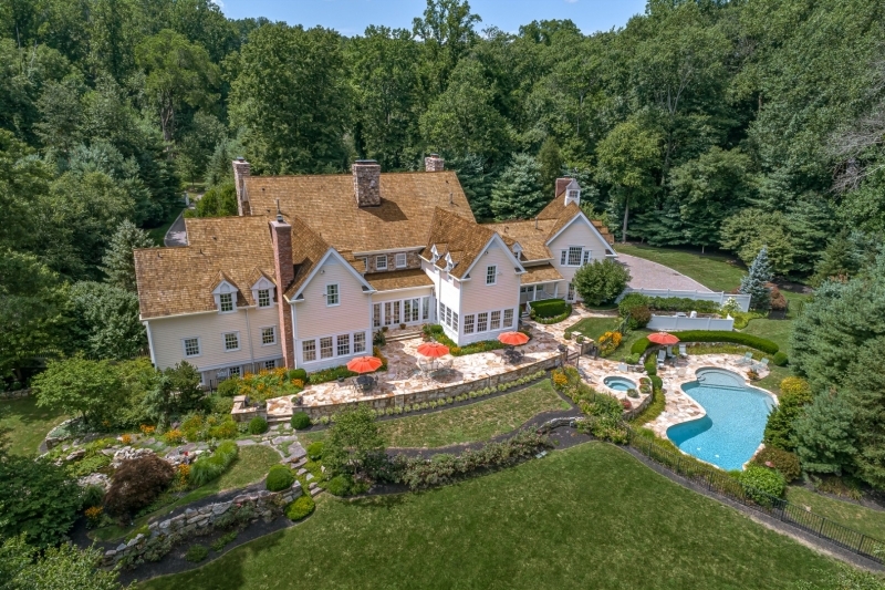 Exceptional finishes, superior construction, and exquisite property are the hallmarks of this authentic Bucks County residence.  Only 45 minutes from Manhattan, and in a premier location with privacy. Designed by Steven Zdepski, this 6 BR, 8.1 BA masterpiece offers a floorplan flooded with natural light and many opportunities for formal and casual entertaining. From the handsome fieldstone elevation, to the gourmet kitchen, expansive master suite, and en suite guest rooms, every detail is cared for in exemplary fashion. The Game Room, a relaxing retreat on the second level of the home, offers a beamed ceiling, cherry paneling, and accoutrements reminiscent of a refined country club. Outdoors, the stone terrace and patio areas lead to the gunite pool, formal gardens, koi pond, and pastoral views.