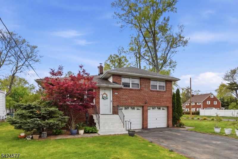 This spacious split-level home offers a fantastic opportunity to create something truly special. Situated on a level corner lot, the property provides excellent curb appeal, added privacy, and plenty of outdoor space for entertaining, gardening, or future enhancements. Inside, you'll find generously sized bedrooms, a practical and versatile layout, and abundant natural light throughout. The split-level design offers flexibility for comfortable everyday living, with multiple living spaces that can easily adapt to your lifestyle needs. A 2-car garage adds convenience, storage, and functionality. Commuters will appreciate the close proximity to major transportation routes, shopping, dining, and everyday essentials, making this location both convenient and connected. This home has solid bones, great space, and endless potential it simply needs a bit of vision and loving attention to truly shine again. Whether you're looking for your next home or an investment with upside, this is a rare opportunity to add value in a well-established neighborhood.