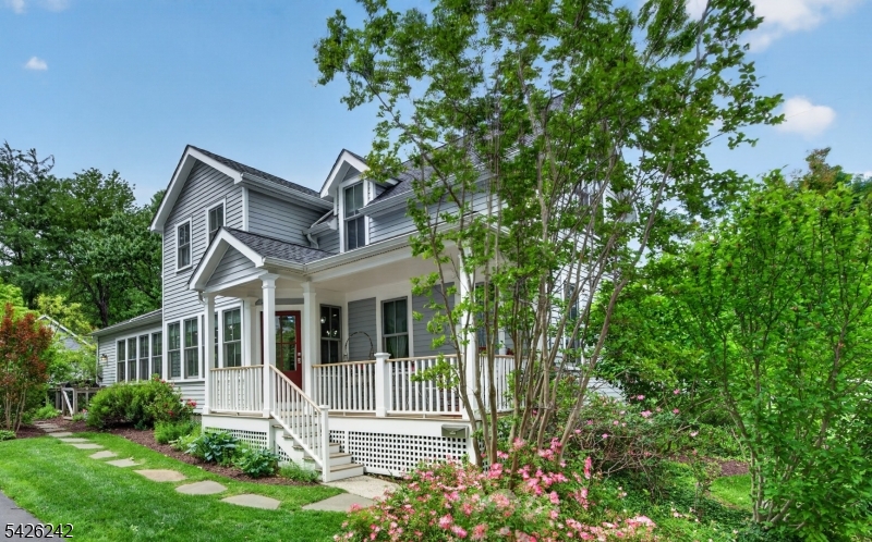 Meticulously maintained 4 Bed, 3 Full Bath Custom Colonial designed by renowned architect John James blends timeless character with modern updates. Having been completely renovated to the studs in 2016, major improvements include newer windows, roof, HVAC, plumbing, electrical, lawn sprinklers and cedar clapboard siding. The covered front porch opens to a bright, open floor plan featuring oak hardwood floors, soaring ceilings, crown molding and recessed lighting. The living and dining areas flow seamlessly into the chef's eat-in kitchen complete with custom white cabinetry, granite countertops, stainless steel appliances and pantry. French doors open to a paved patio and beautifully landscaped backyard and the adjacent sitting with gas fireplace and garden views. The 1st floor includes a bedroom and full bath, perfect for guests or one-floor living. Upstairs, the primary suite boasts a walk-in closet and a luxurious bathroom. 2 additional bedrooms and a full hall bath complete the 2nd level. The lower level offers laundry and storage. Situated on a beautifully landscaped lot, the property includes a detached 2-car garage with potential studio space. Located in the top-rated Millburn Public School District, just 2 blocks from Wyoming Elementary. Convenient to downtown Millburn and Maplewood, shopping, dining, major highways + Midtown Direct trains service to NYC. A rare opportunity to own a thoughtfully renovated home in one of New Jersey's most sought-after communities.