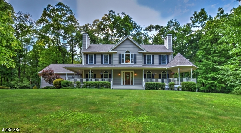 Privacy abounds on this equestrian property w/ a beautiful custom home on almost 6 AC. Enter this immaculate 3bd. 2.5bth home thru the peaceful rocking chair front porch complete w/ sitting area. Main level opens w/ grand 2 story entry,custom kitchen, brkfst area open to a lrg FR w/ WB FP, DR + LR w/ gas FP. Upstairs has 3 generous bds + full LR w/ sink. Large deck w/ a built in gas grill. Relax in the hot-tub or hammock & overlook the expansive sequestered backyard. Set back is a perfect ctr. aisle 2 stall custom red barn & pastures.  The barn features, wtr + elec, heated office/feed/tack rm + hayloft. Backs to state land - easily access the horse/walking trails in Swartswood Park. Complete seclusion only 10 minutes to Shop Rite & Newton. Custom, privacy & high end amenities- exactly what ur looking for!