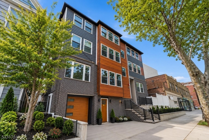 *Highest and best due by Tuesday May 19th 5pm.* A true showstopper on JFK Blvd in the West Side of Jersey City. This newly constructed 3-family blends modern design, strong rental income potential, PARKING, and outdoor space all in one. Offering 9 bedrooms and 7 full bathrooms, this rare multifamily is perfect for investors or owner-occupants looking to house hack. Designed with today's lifestyle in mind, the property features open-concept layouts, oversized windows bringing in incredible natural light, private balconies, a private paved patio, hardwood floors, recessed lighting, central ac and heat and in-unit laundry!. The expansive first-floor duplex offers 3 bedrooms, 3 full baths, multiple entryways, office space, 2 living areas, and garage access, while Units 2 and 3 each feature modern 3 bedrooms, 2 bath layouts with primary ensuites and balconies. Complete with a 1-car garage plus driveway parking for 2 additional cars. Located just moments from the Light Rail, direct NYC transportation take the bus or shuttle from JFK, this is a true commuter's dream and exceptional income-generating opportunity.