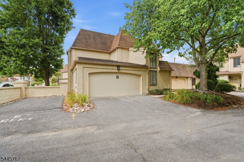 Be the first to enjoy this fully renovated 2 bedroom, 1.5 bath ground-level condo in one of North Edison's most desirable gated communities. With 24-hour security and resort-style amenities sparkling in-ground pool, tennis and volleyball courts, playground, and bike trails this end-unit home blends comfort and convenience. The layout offers two private patios, a dedicated driveway, and an attached garage. Inside, every detail has been refreshed, from the neutral palette to Scandinavian-style wide plank flooring. The brand-new kitchen features white shaker cabinetry, marble-finish quartz counters, abundant storage, and a full stainless appliance suite including a 5-burner gas range, refrigerator, dishwasher, and microwave. A large breakfast bar opens to the dining room and adjacent living room, ideal for entertaining. On chilly evenings, enjoy the wood-burning fireplace and dimmable recessed lighting. The main bath, also a primary ensuite, showcases a dual-sink quartz vanity, gold accents, designer lighting, and a pocket door for added privacy. The spacious primary bedroom offers outdoor access and a walk-in closet with custom organizers. Freshly painted and beautifully finished, this chic home is minutes from downtown Metuchen, JP Stevens High School, major commuter routes, and rail lines. Truly perfect.