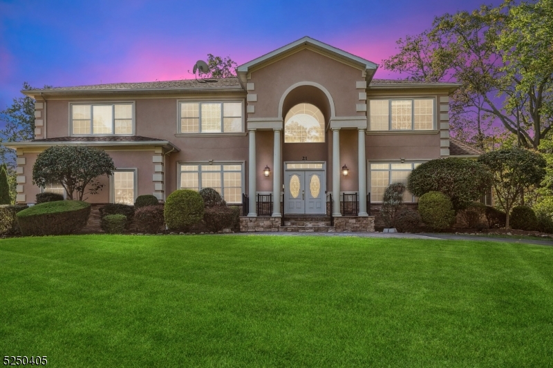 Livingston Dream Home!  Prepare to be WOWED by this luxury Custom Colonial boasting 4500+ sq ft of living area, 2500 sq ft basement, double height garage and an impressive 1,400 sq ft granite patio looking out to the vast private wooded backyard!  An impressive circular driveway with brick paver design leads to a grand two story entrance hall with extra wide circular oak stairs,  double height family room with gas fireplace, coffered ceiling dining room and beautiful cathedral ceiling library sunroom.  Enjoy an easy flow for entertaining with porch access from both the kitchen and sunroom and appreciate the custom ceiling millwork throughout. This beautiful home offers a fantastic layout with five bedrooms all with attached bathrooms, 1st floor in-law suite with full bath and built-in dresser and storage, and a large primary suite with huge 1,000+ sq ft private deck, 2 huge walk-in closets and a generous spa-like bath with built-in dressing area.  The large lower level is perfect for recreation and entertaining, featuring a wet bar, home theatre with built in seating, sitting area, powder room and plenty of room for storage and a double height two car garage with side entrance for convenience.  This gorgeous home is ideally situated at the end of a quiet cul-de-sac surrounded by the serene reservation! Just a 0.5 mile walk to highly rated Heritage Middle School. Livingston has top schools - was ranked 12th best school district in all of New Jersey for 2023!