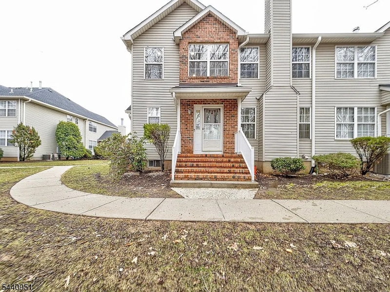 Welcome to this North Facing Beautifully Updated End-unit townhouse with Views of Nature! This spacious 3br, 2.5 bath with finished basement home feels more like a single-family residence. The interior features gleaming laminate flooring, recessed lighting throughout, and plenty of natural light. The amazing kitchen boasts granite counters, stainless steel appliances and plenty of cabinets for the chef in you. Enjoy the formal living room with fireplace and family room for entertaining. Upstairs, the spacious primary suite offers a full bath, walk-in closet, and additional space for home office or reading nook. Two generous sized bedrooms and full bath complete the second level. The fully finished basement offers fantastic extra living space, featuring a large recreation room, office, dedicated laundry area with sink, washer/dryer, 2nd refrigerator, theater speaker system, utility room, and plenty of storage. Relax with treed views from the large patio. Enjoy a low-maintenance lifestyle with lawn care, snow removal, trash service, and master insurance all included in the HOA. Plus, you'll have access to excellent community perks like the outdoor pool and tennis courts! A true must see!