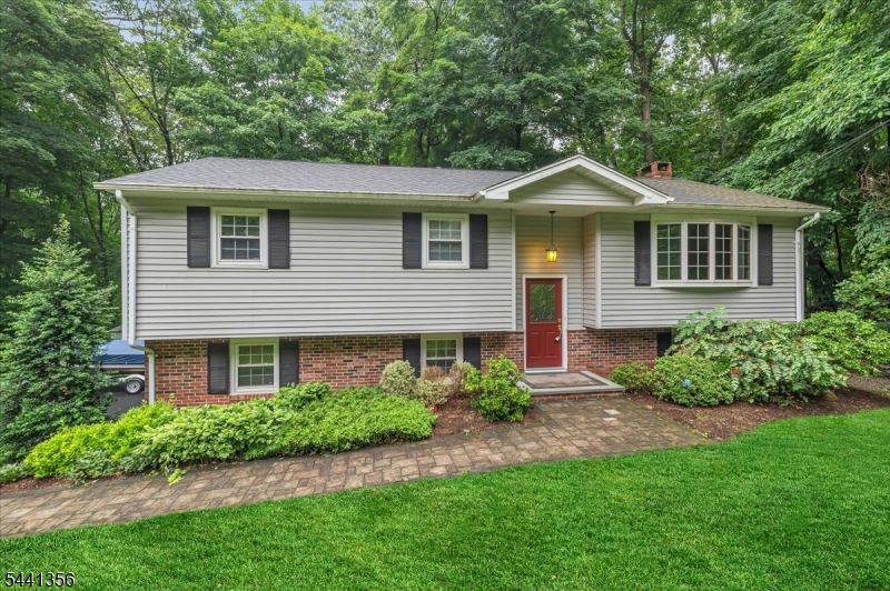 Nestled on a quiet cul-de-sac road in Ringwood's desirable Skyline Lakes section, this 3-bedroom, 2 bath bi-level offers a wonderful opportunity to make a well-cared-for home your own. Maintained by the original owners, the property reflects years of thoughtful upkeep and pride of ownership. The main level features hardwood floors, an updated full bathroom, and an updated kitchen with stainless steel appliances. Step outside to the deck and enjoy peaceful views of the surrounding landscape. The finished lower level provides valuable additional living space with a fireplace, custom built-ins, and walk-out access to the backyard, making it perfect for a family room, recreation area, home office, or flexible living space. Additional features include central air conditioning on the main level and a heated garage. For added peace of mind, there is also a generator hook-up. Located in the Skyline Lakes community, lake membership is optional, allowing residents the opportunity to enjoy the lake and community amenities. Offering a desirable location, solid updates, and endless potential, this estate property is ready for its next chapter.