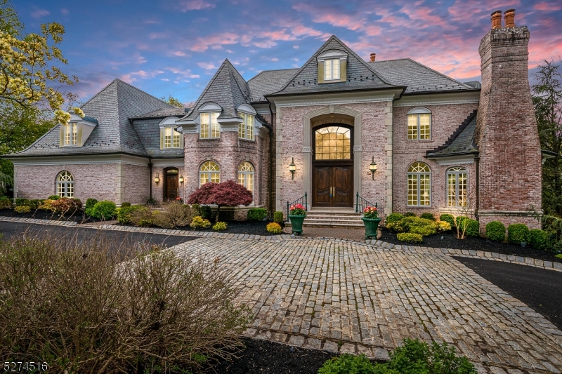 In Attorney Review but STILL SHOWING.  They say Money can't Buy Happiness, but this house will get you 99.9% there!. Be prepared to be Dazzled. Custom home in a very desirable neighborhood.. Experience the circular driveway which leads to the formal front entry and opens to a magnificent Grand Stairway in the marble foyer.  5 Bedrooms,  5 Fireplaces, and 6 Baths. Three floors of exceptional architecture, tray ceilings, marble floors, and spacious interiors. All of the amenities you'd expect in this caliber of home. Sub-Zero Refrigerator, 6 burner Thermador range/over with a open floor plan that will please the most discerning buyer. The full finished basement includes Radiant Floor Heat, a separate Gym area, Wet Bar, Billiard area, rec-room and lounge. Plus 2 fireplaces. Step outdoors to the covered Patio leading to the custom heated in-ground swimming pool. Don't forget the 4 Car attached Garage.The Master bedroom is spectacular. Measuring 33.5' X 16' and Adjoining the Bathroom suite of 21' X 14.5' which leads to the hugh walk in closet/dressing room.See this now. You wont be disappointed.. ELEVATOR SERVICES ALL 3 FLOORS!!  Images courtesy of Rom Chaudemanche Photography.