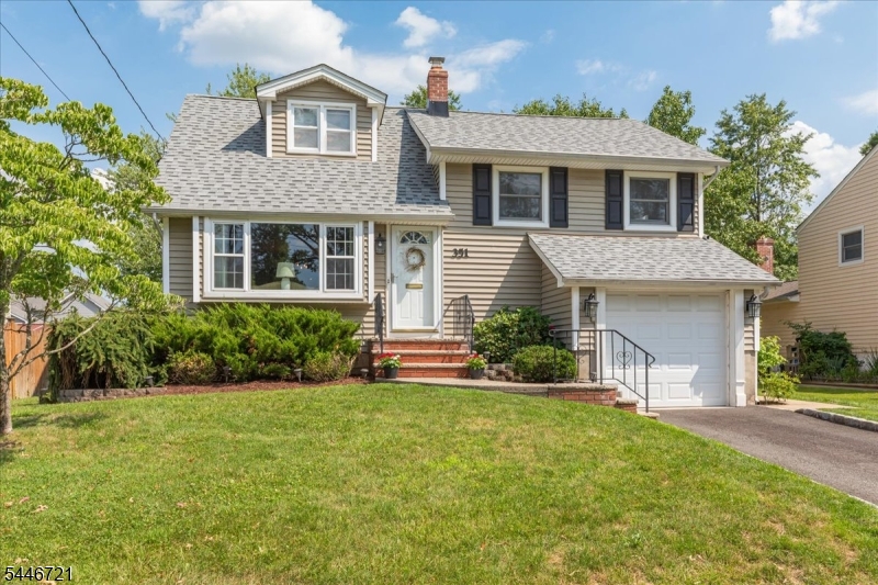 Pride of ownership shines throughout this impeccably maintained 3BR, 2BA home, beautifully expanded on a wide, tree-lined street. Renovated Kitchen features granite countertops, SS appls, dbl wall ovens & 5-burner gas range. Expansive FR addition offers soaring ceilings, recessed lighting & gas FP, creating the perfect space for everyday living & gathering. Outdoor living is equally inviting with a composite deck featuring a retractable awning overlooking a beautiful paver patio, creating a comfortable outdoor retreat for relaxing or entertaining. Add'l features incl. CAC, NEW roof (Nov. 2025), replacement windows, irrigation system, vinyl siding & attached 1-car garage. Dry basement offers abundant storage & finishing potential. Ideally located approx. 0.7 mi to vibrant downtown Cranford, NYC train, restaurants & shops, and close to WAS, LIV, parks & more. Meticulously cared for inside & out, this exceptional home offers timeless quality, thoughtful updates & an opportunity to enjoy all that makes Cranford such a special place to call home. *3rd fl. bedroom window a/c is supplemental.