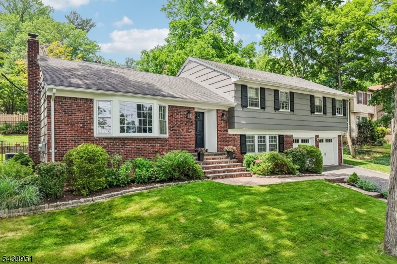 The Home You've Been Waiting For! Perfectly positioned in one of Maplewood's most sought-after neighborhoods, this beautifully updated home blends classic character with modern comfort. A welcoming foyer opens to an updated kitchen, a spacious dining room ideal for gatherings, and an oversized, sun-filled living room, creating an effortless flow for everyday living and entertaining. The primary bedroom offers a walk-in closet and an elegant en-suite bath, a true retreat at the end of the day. Two additional generously sized bedrooms and a well-appointed main bath complete the upper level. The flexible ground level adds even more living space, featuring a large den, full bath, and a fourth bedroom, perfect for guests or a home office. The lower level offers a versatile recreation room plus a cedar closet for extra storage. An attached two-car garage rounds out the home's everyday convenience. Ideally located near the vibrant shops, boutiques, and acclaimed restaurants of Maplewood Village, with easy access to parks, community events, and Midtown Direct train service to NYC. Memorial Park and the South Mountain Reservation are just moments away, offering endless opportunities for outdoor recreation. This isn't just a house, it's where your next chapter begins!