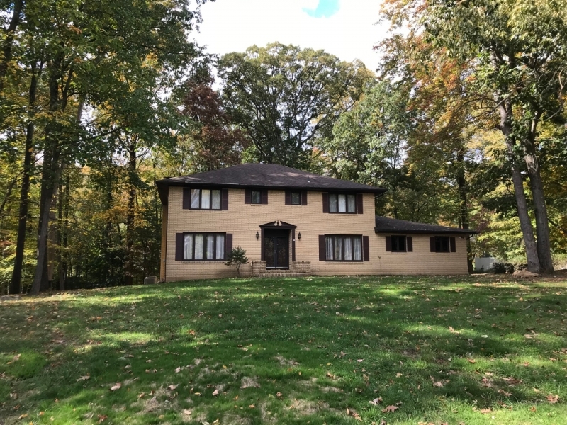 Full brick front colonial on 1 acre lot, with large foyer and 2 double closets. Hard wood floors, Large kitchen with sliders to deck. Cherry cabinets, recessed lighting and double pantry. Family room with fireplace and raised hearth. Recessed lighting and sliders also to deck. First floor bedroom with full bath, off laundry area. Second floor with Large master bedroom and Master bath . There are 3 more bedrooms and full bath on second floor plus walk in closets.  Full basement.  Amenities include 14x40 deck, central vacumn, underground sprinkler system, Newer water heater and water softner.