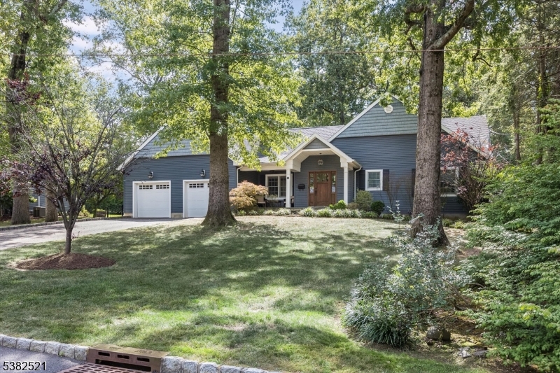 This exceptional 4-bedroom, 4.1-bath ranch was masterfully gut-renovated and thoughtfully expanded in 2012. Designed with a courtyard concept, the home creates a seamless connection between indoor and outdoor living. Set on over .5 acres of flat property, it sits on a picturesque circle in one of Livingston's most coveted neighborhoods.  The heart of the home is a chef's kitchen with tray ceiling, custom white cabinetry, quartzite countertops, and an oversized island. Wolf and Sub Zero appliances, a farmhouse sink, built-in wine refrigerator, and designer lighting combine timeless style with modern function. The open-concept layout flows into the sun-filled breakfast area and airy family room with soaring ceilings, wood-burning fireplace, and direct patio access.  The versatile floor plan includes four bedrooms, two with en-suite baths. The primary suite offers dual custom walk-in closets, a spa-like bath, and private patio walk-out. A hall bath with tub-shower combo, separate toilet, and linen closet serves the additional bedrooms, while a stylish powder room and mudroom off the oversized 2-car garage complete the level.  The finished basement spans the home's footprint with a built-in bar, recreation and media areas, high-end flooring, and a full bath. Outdoors, a covered dining patio overlooks a wide, level backyard. A rare blend of thoughtful design, timeless finishes, and an idyllic, park-like setting, this move-in-ready home checks every box.