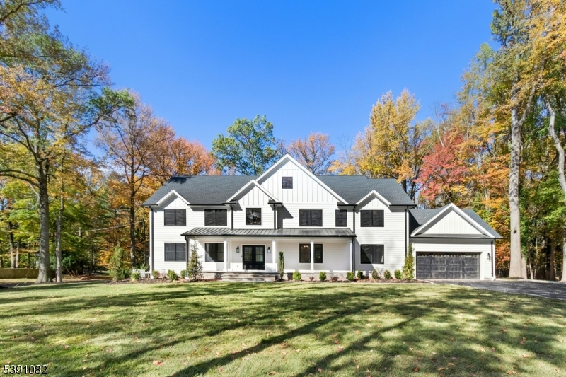 A remarkable new construction home set on a level .95 acre lot is a statement of vision, timeless design, & craftsmanship. Situated in one of Scotch Plains' most desirable neighborhoods, this home seamlessly blends modern sophistication w/ classic architectural elegance. Step inside through the grand double doors into a soaring two-story foyer filled w/ natural light & extraordinary attention to detail. The main level features an open concept layout centered around a state-of-the-art chef?s kitchen w/ Thermador appliances, quartz countertops, custom cabinetry & an adjoining prep kitchen. Upstairs, the primary suite includes a spa-like bath w/ heated floors, & two walk-in showers - a rare indulgence. Two bedrooms share a Jack & Jill bath while the remaining bedroom has a private bath. The finished attic w/ full bath provides options for a second office, gym, or creative retreat. A sprawling basement is anchored by a custom bar, a full bath, & a bedroom w/ an oversized egress window. Prepare to design the ultimate outdoor space w/ the paver patio, irrigation system, & fresh sod. The interior details are both refined & enduring: 4" white oak flooring, white oak wood beam ceilings, extensive custom millwork, Andersen 400 Series black windows, hand-selected designer lighting, Sonos sound system, Kohler fixtures, & exquisite tile selections. This home provides for a wonderfully elevated lifestyle - a truly extraordinary opportunity in Scotch Plains.